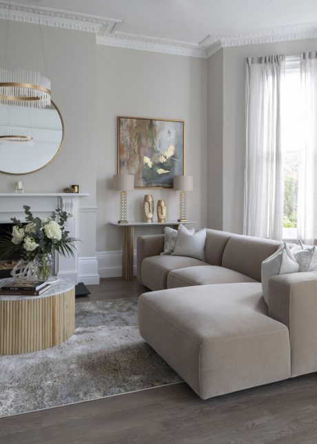 Sofa and coffee table in living room with beige and cream colour scheme