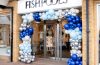 Fishpools furniture store exterior entrance with balloons around doorway