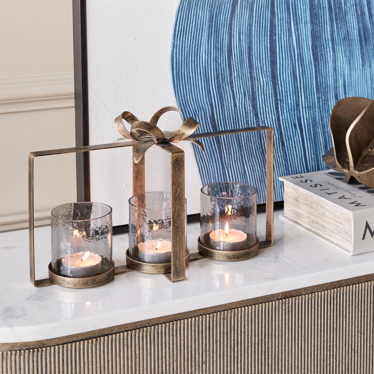 Bow 3 Light - Hurricane Candle Holder, Aged Gold