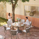 Martinique - 6 Seat Round Garden Dining Table and Chairs Set, Champagne Aluminium & Sintered Stone